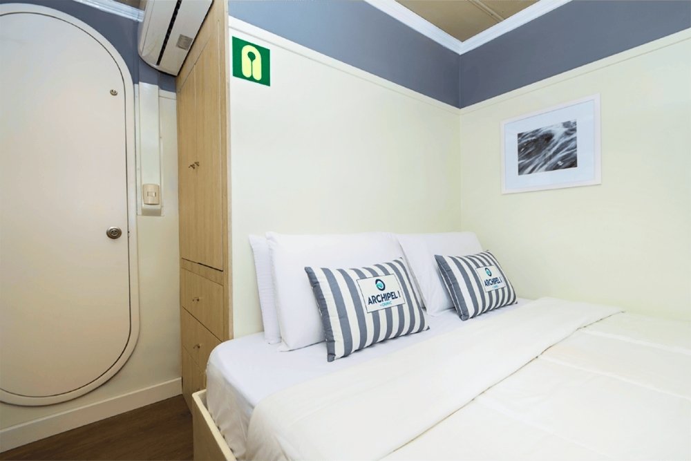 Comfortable double bed at the Archipel I Galapagos Cruise Cabin