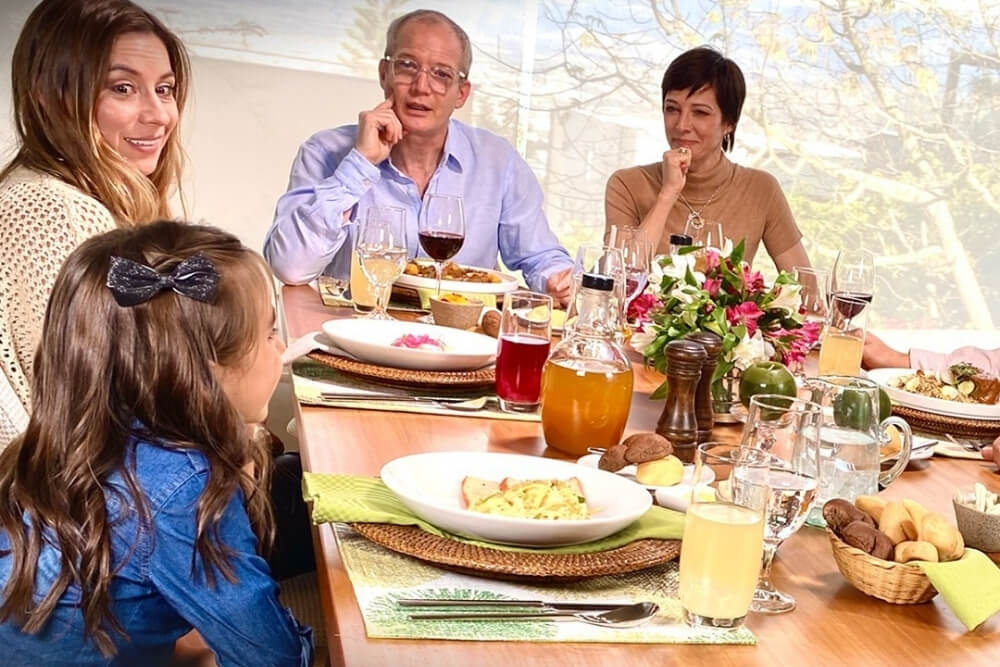 family enjoying a meal together during family dining at casa gangotena restaurant in quito