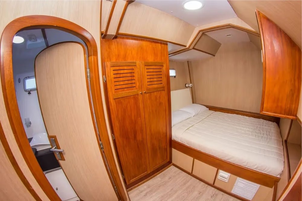 Cozy bed in a small cabin aboard the Nemo III