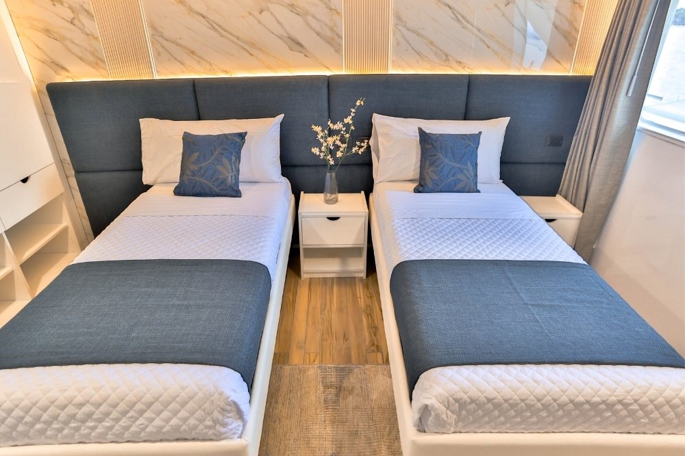 two cozy beds at the cabin of the galaxy diver ii yacht