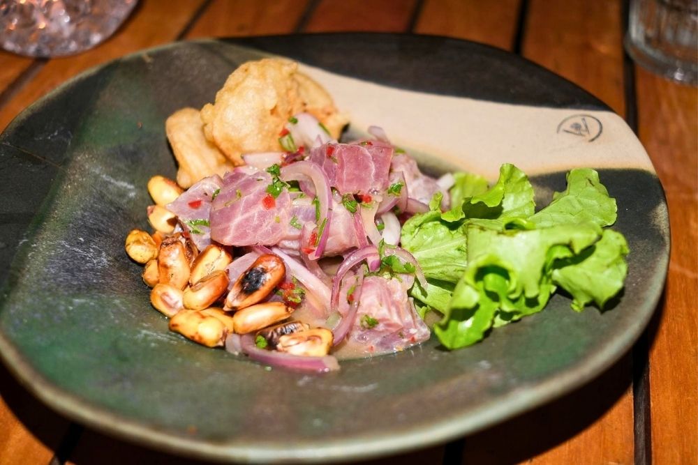 Fresh tuna ceviche with toasted corn and lettuce at Midori San Cristobal during an interactive cooking class session