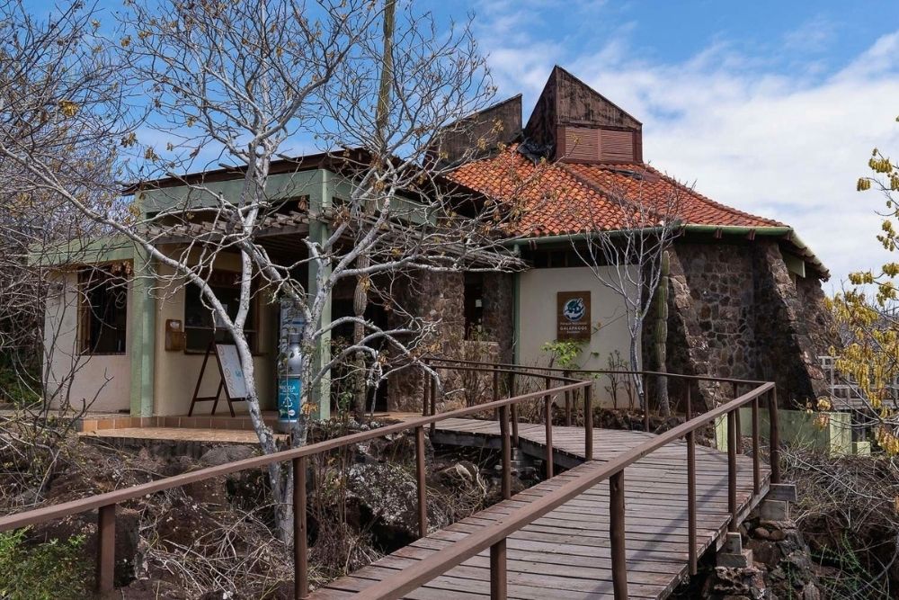 Wooden walkway leading to the San Cristobal Interpretation Center building during a mashpi lodge and galapagos tour