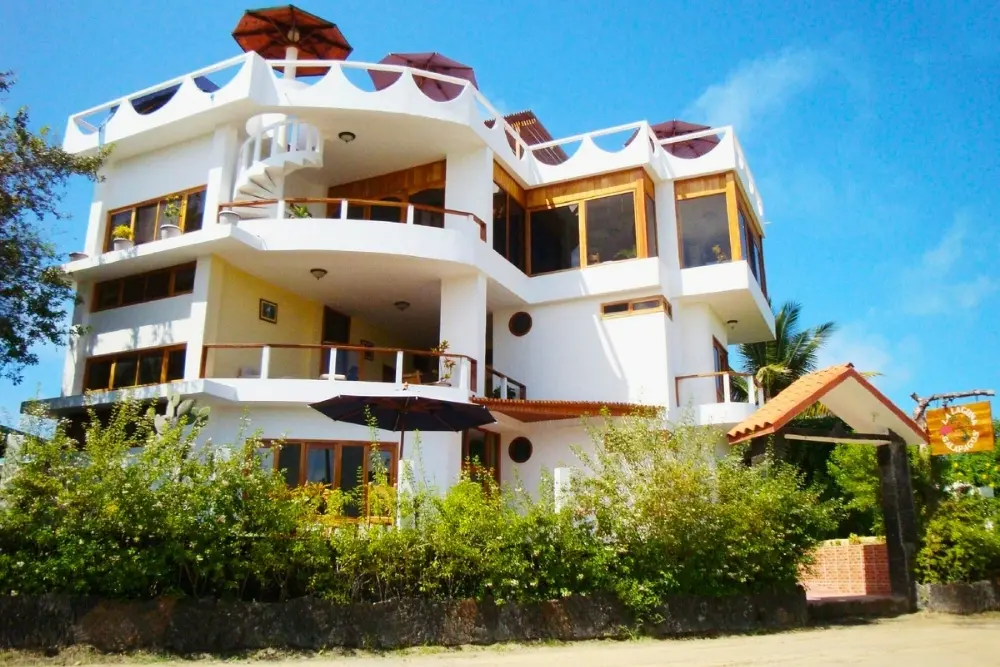 White multi-level exterior of Hotel La Laguna Galápagos in Puerto Villamil, Isabela Island