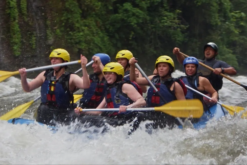 Thrilling white water rafting Baños trip through wild river rapids during an Ecuador multisport adventure tour