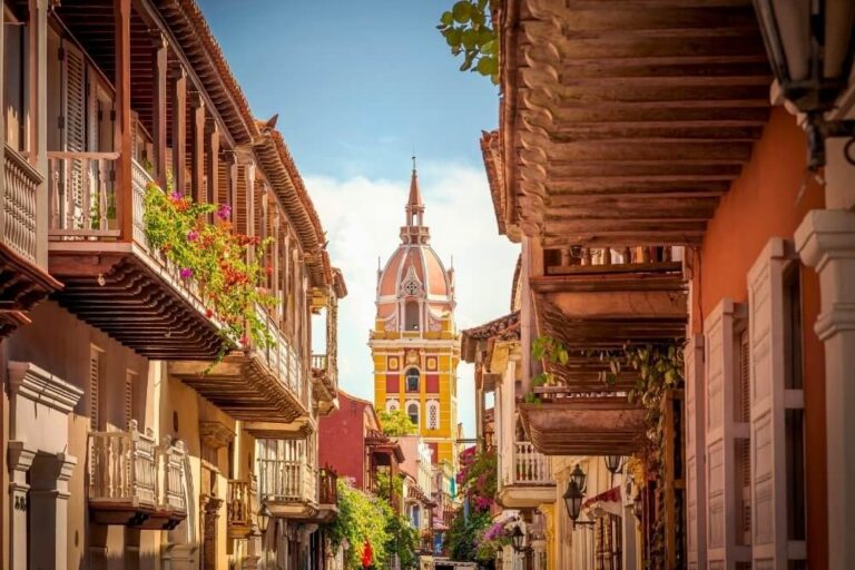 colorful streets of cartagena de indias with colonial buildings and the iconic church tower in the background