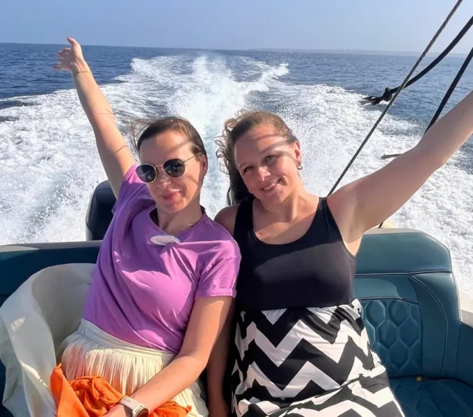 a sun-drenched private catamaran glides across the turquoise caribbean waters toward the white-sand beaches of the rosario islands during a luxury travel to cartagena colombia experience.
