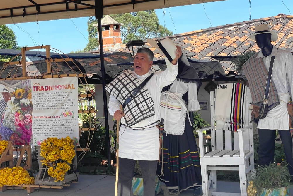 medellin locals talking about the story of the flower festival.