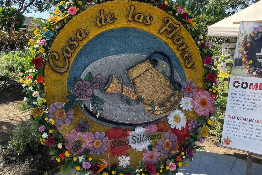 silleta flower arrangement exhibited in medellin flower festival reads house of the flowers