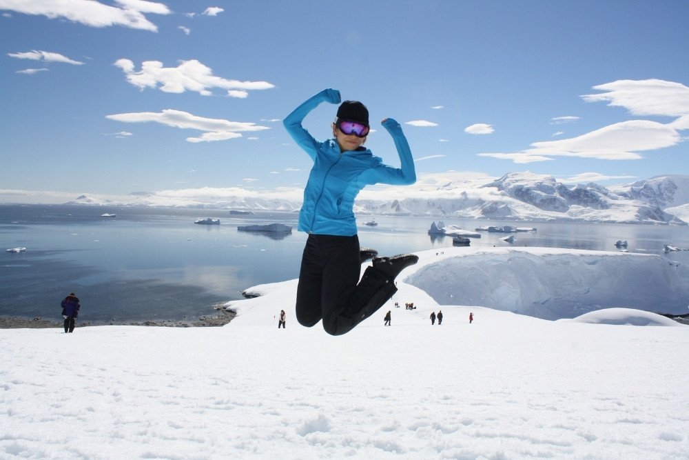 happy traveler in an antarctica luxury travel